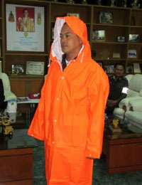 Presents raincoats to local police